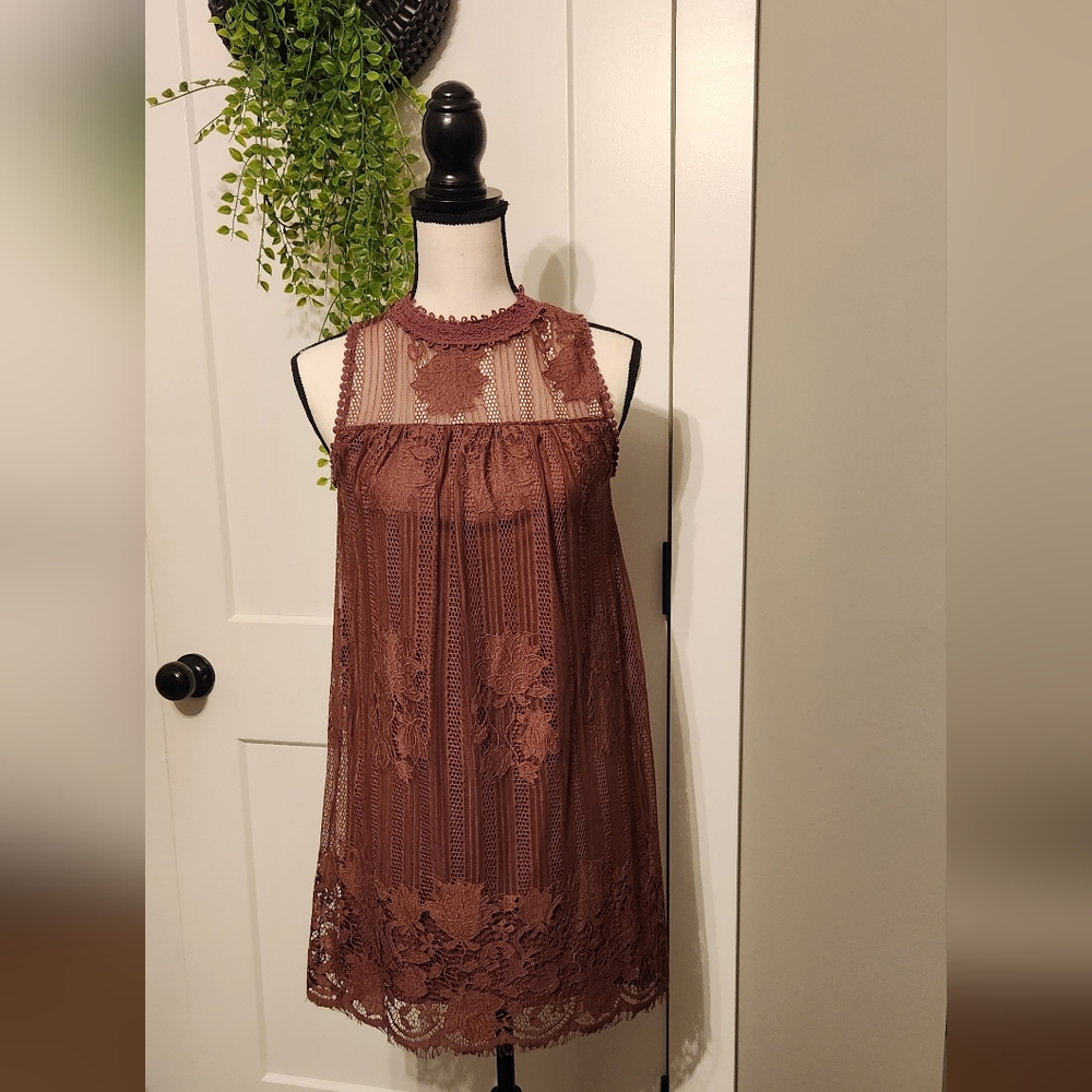 Beautiful sleeveless. Size XS. Like new without tags.